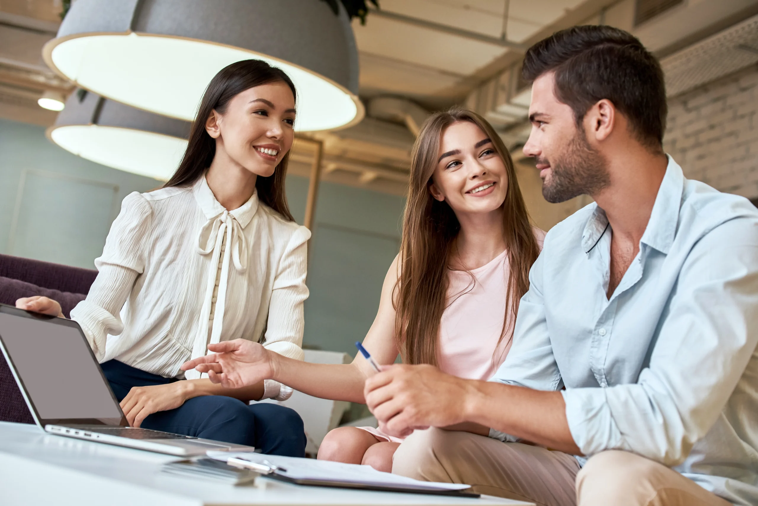 A business consultant discussing inventory management system architecture with clients, focusing on technology-driven solutions for warehouse and supply chain efficiency.