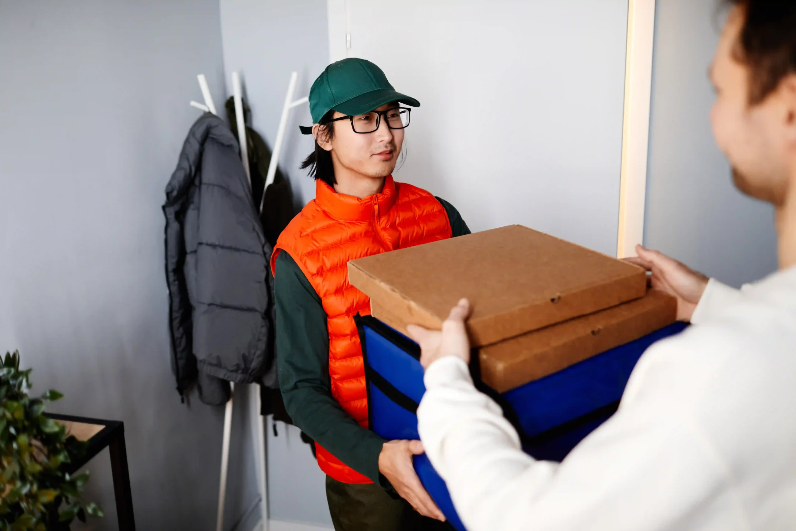 Delivery personnel handing off packages on time, a key step in the perfect order fulfillment formula