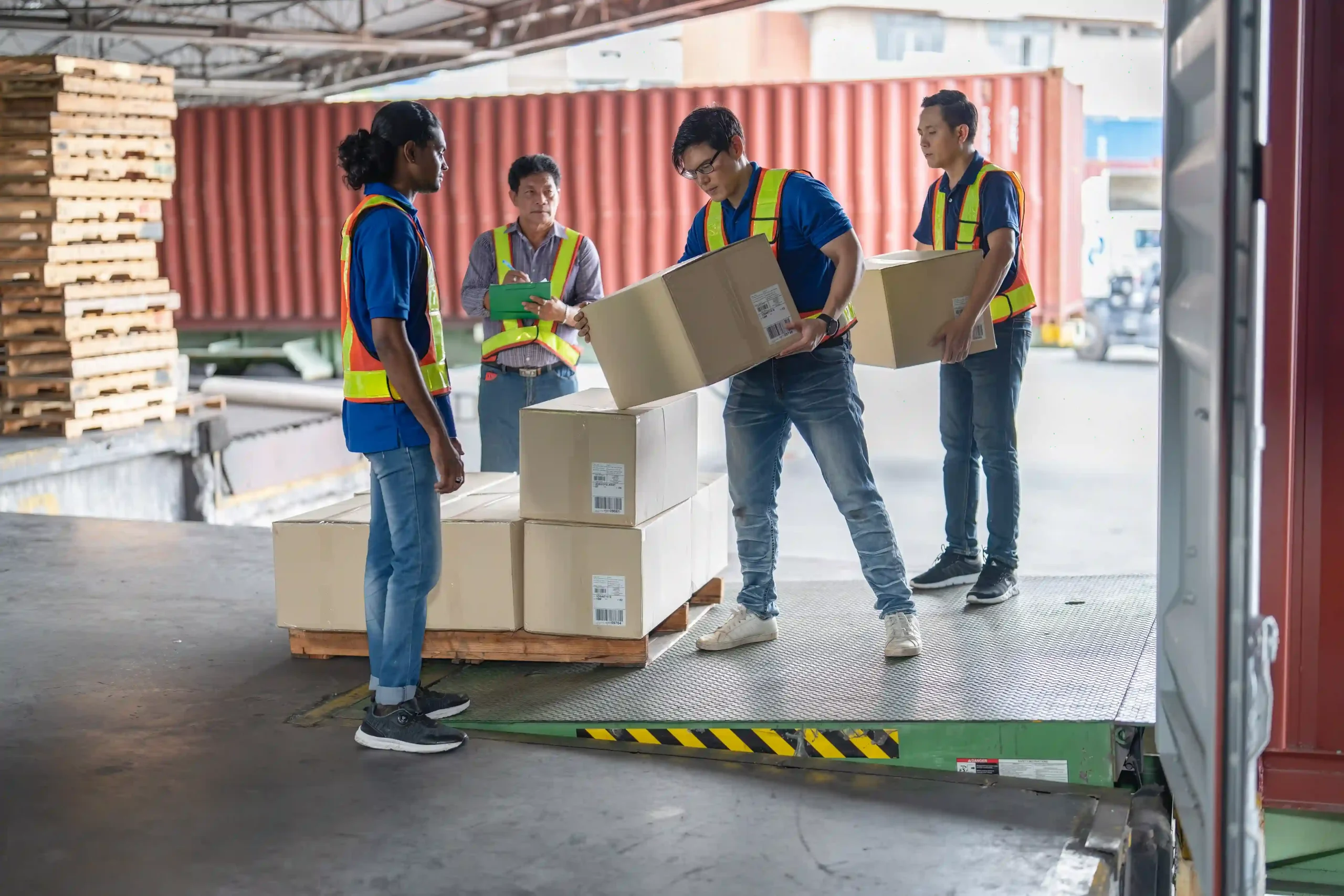 Workers loading shipments affected by tariff changes and impact 2025