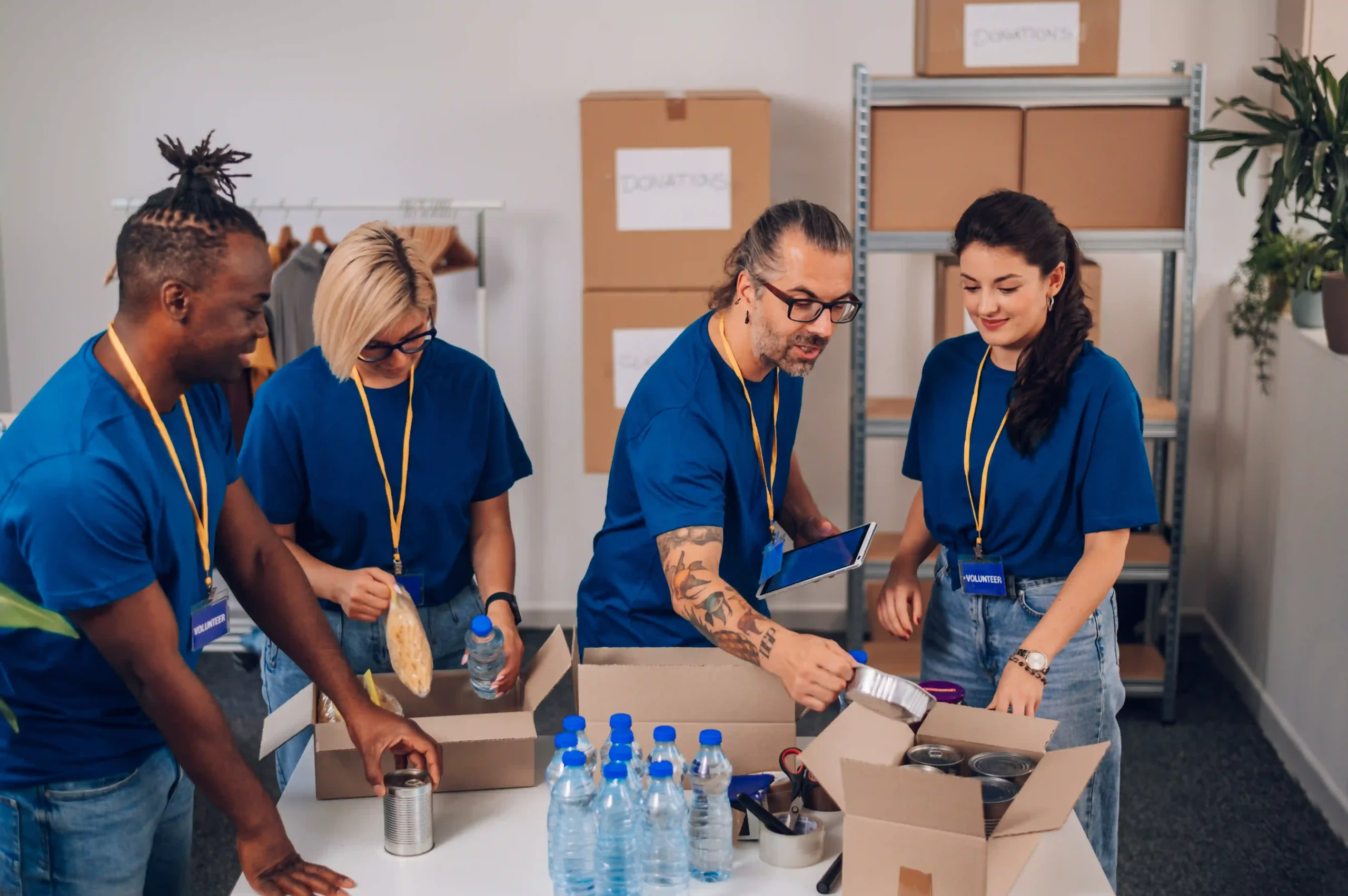 3PL packaging team assembling custom donation kits in a fulfillment center