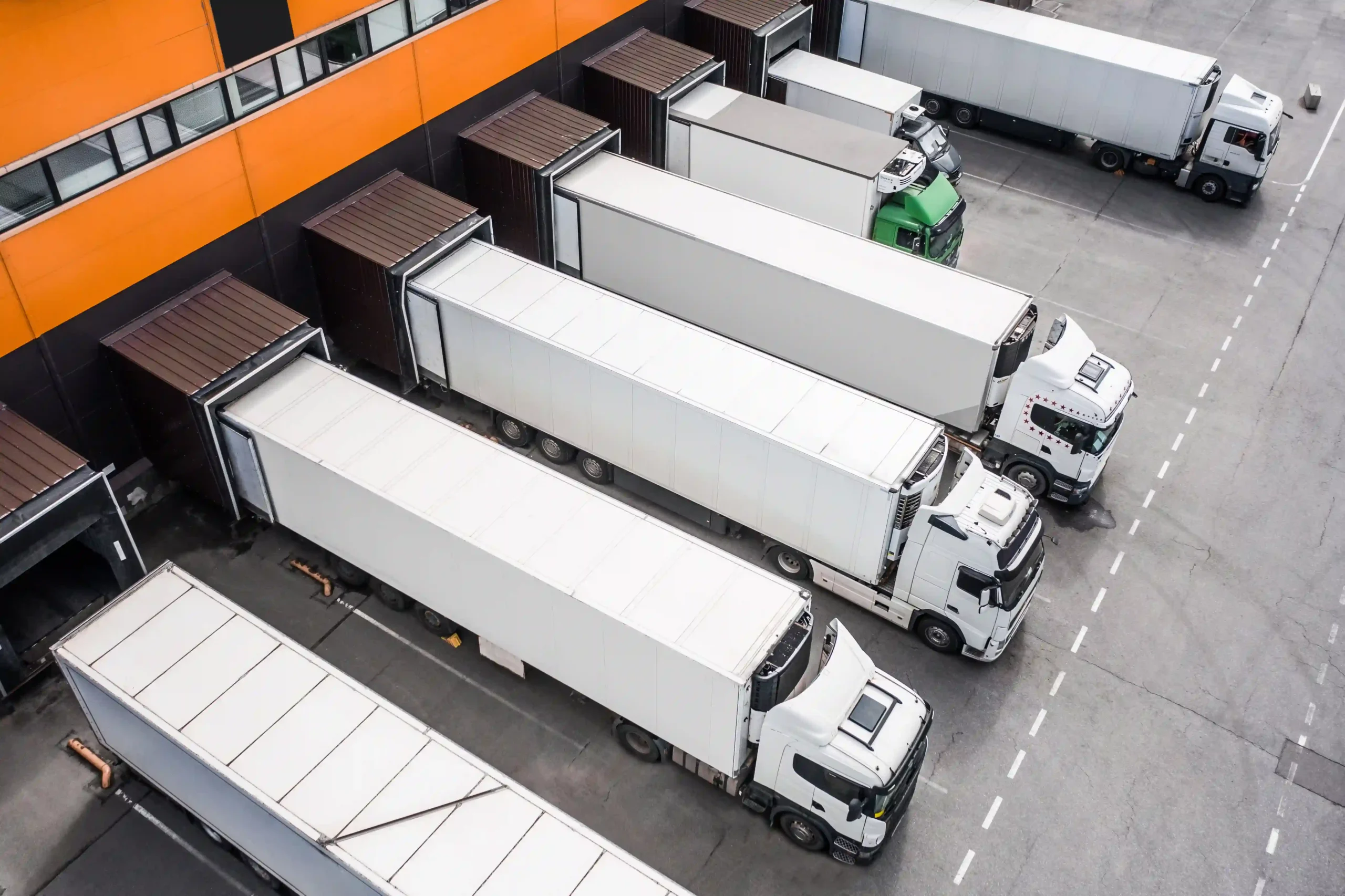 Multiple trucks at a logistics hub for cross-docking and transloading activities