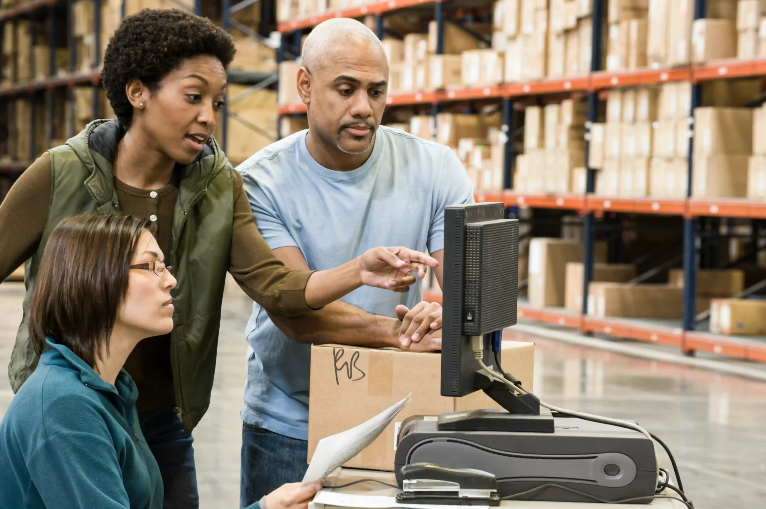 Logistics team using digital tools to monitor real-time order fulfillment metrics