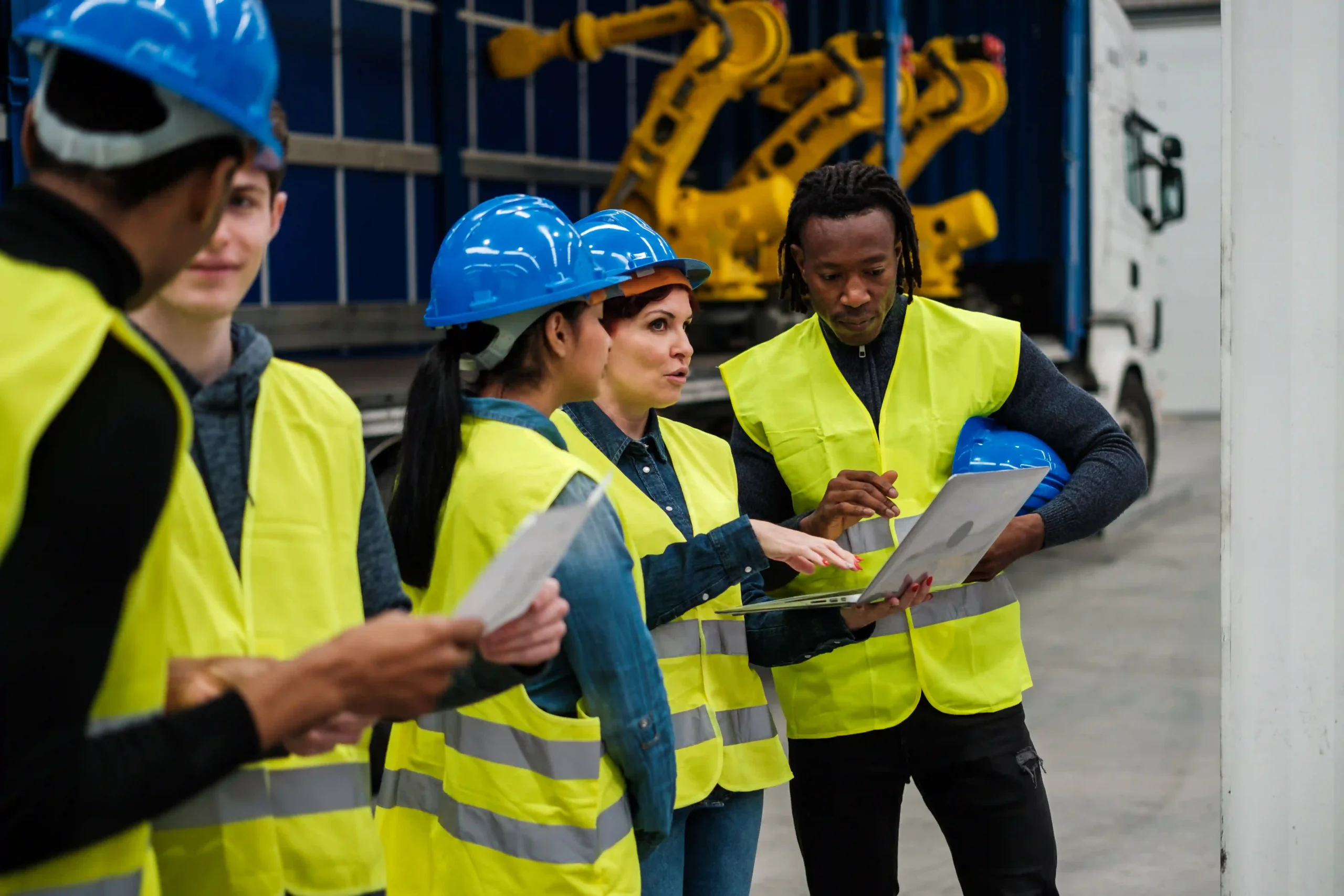 A supply chain optimization manager working with robotics industry professionals to integrate automation into warehouse management.