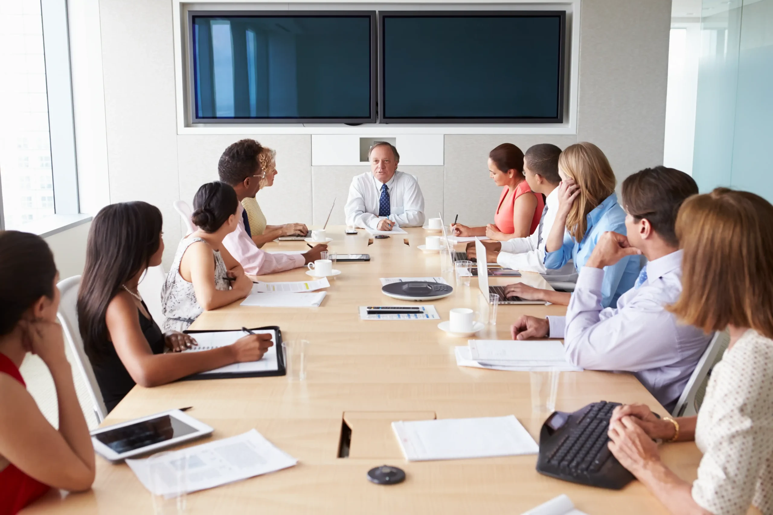 Boardroom discussion focusing on corporate governance and regulatory adherence.