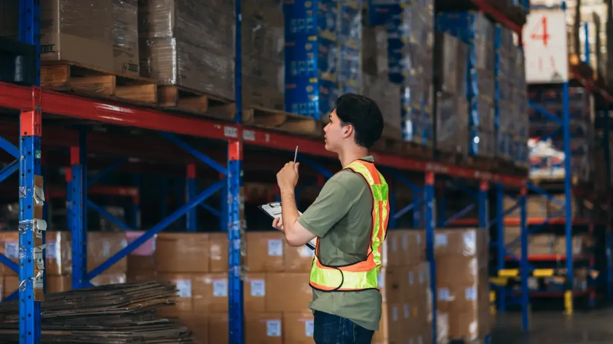 Warehouse staff managing and inspecting inventory using advanced FTZ Inventory Control systems.