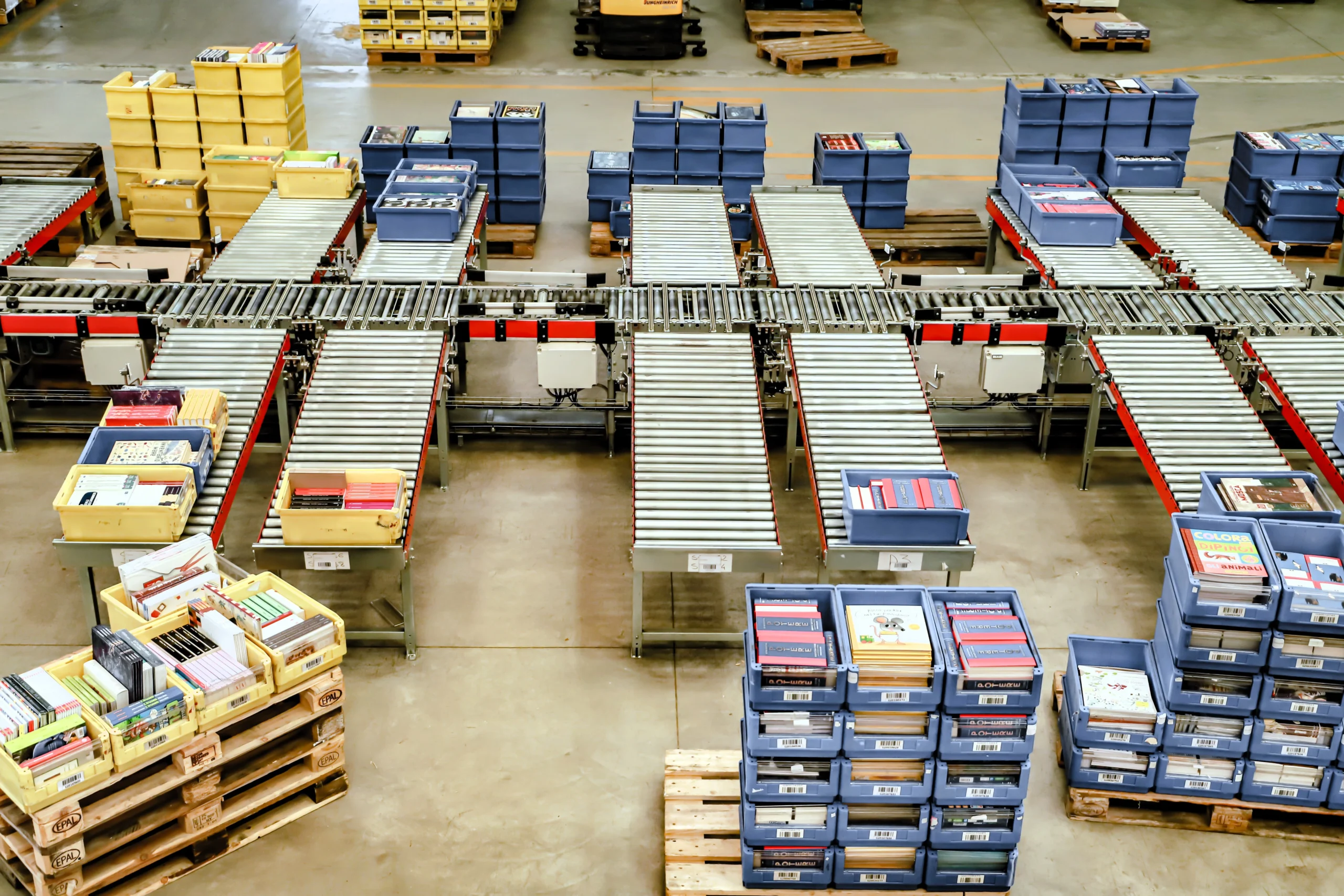 Conveyor belts inside a logistics warehouse showcasing sorting and cross docking processes for efficient supply chain management.