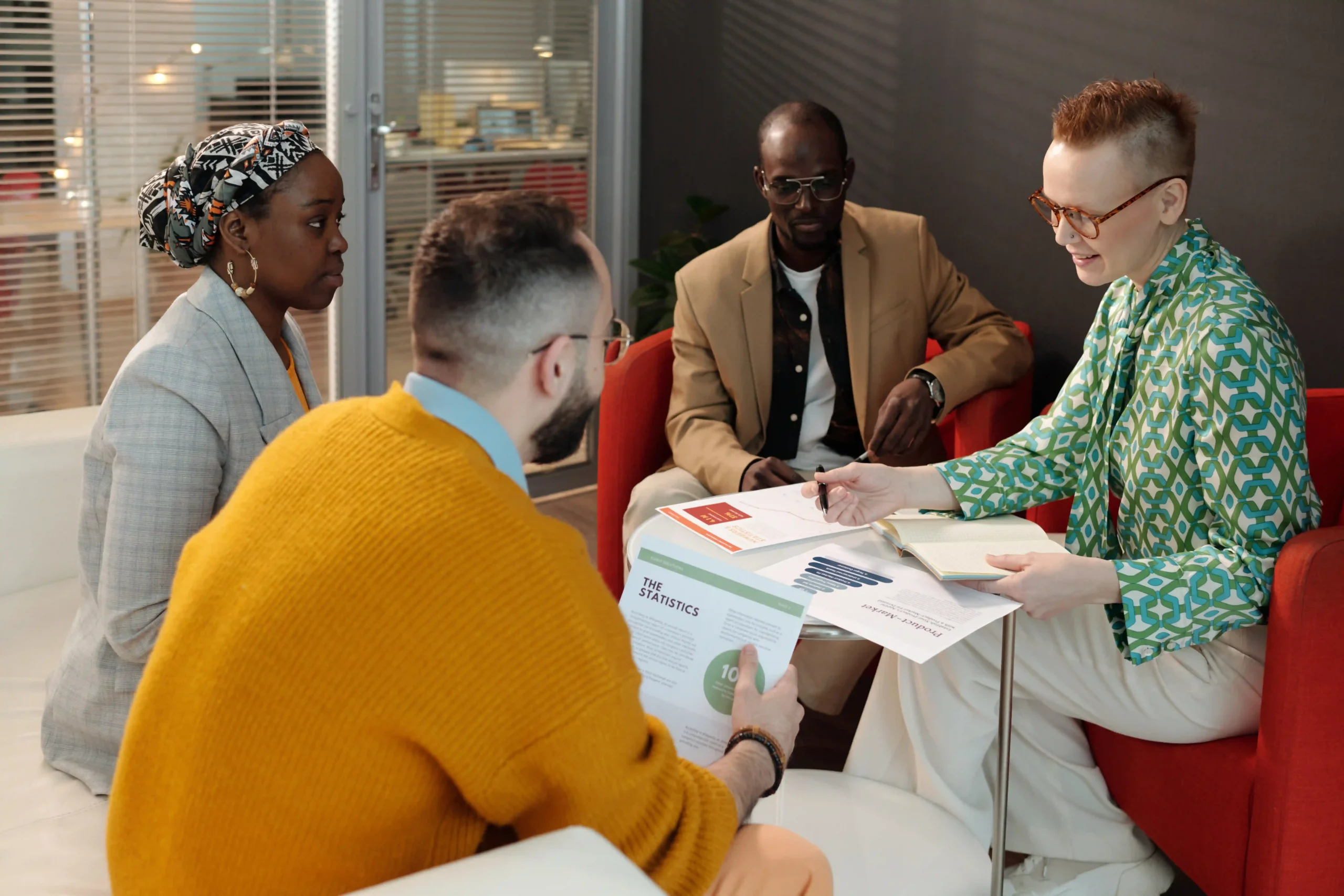 A diverse group of FTZ consulting professionals discussing supply chain strategy and duty savings in a corporate office.