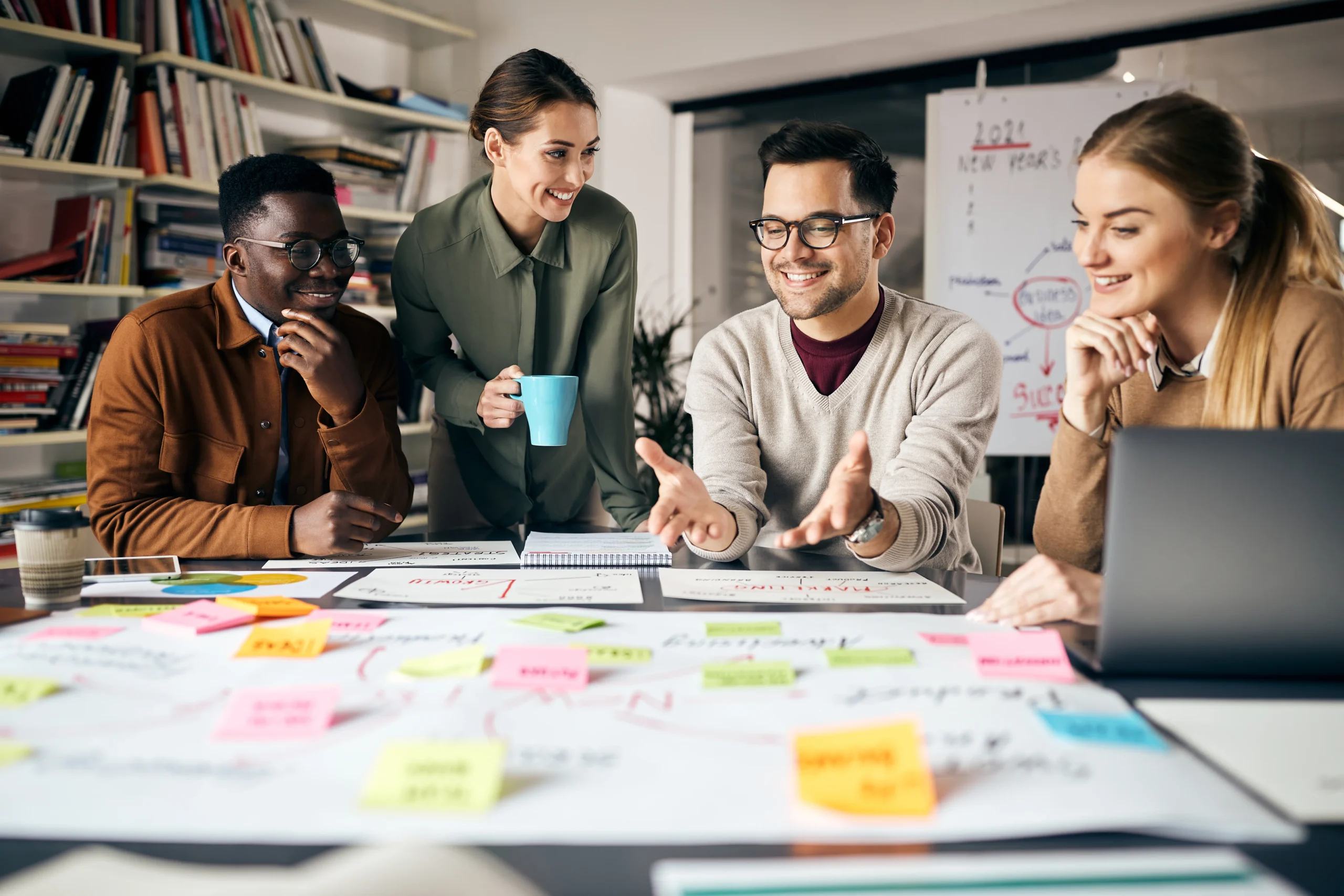 A diverse business team brainstorming and strategizing inventory management solutions, discussing warehouse optimization, automation, and real-time inventory tracking.