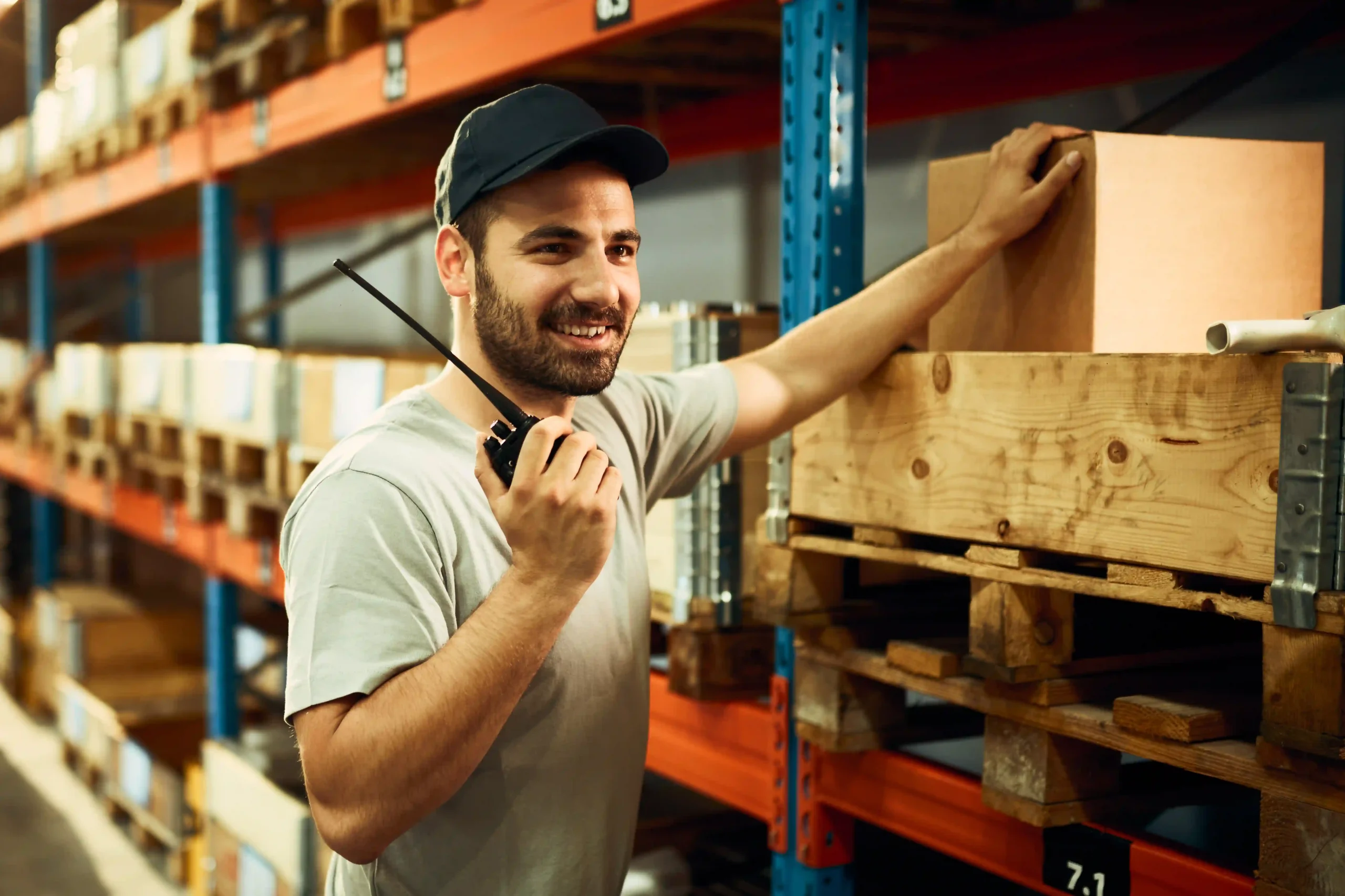 A warehouse employee coordinating shipments using a pick and ship service for faster logistics.