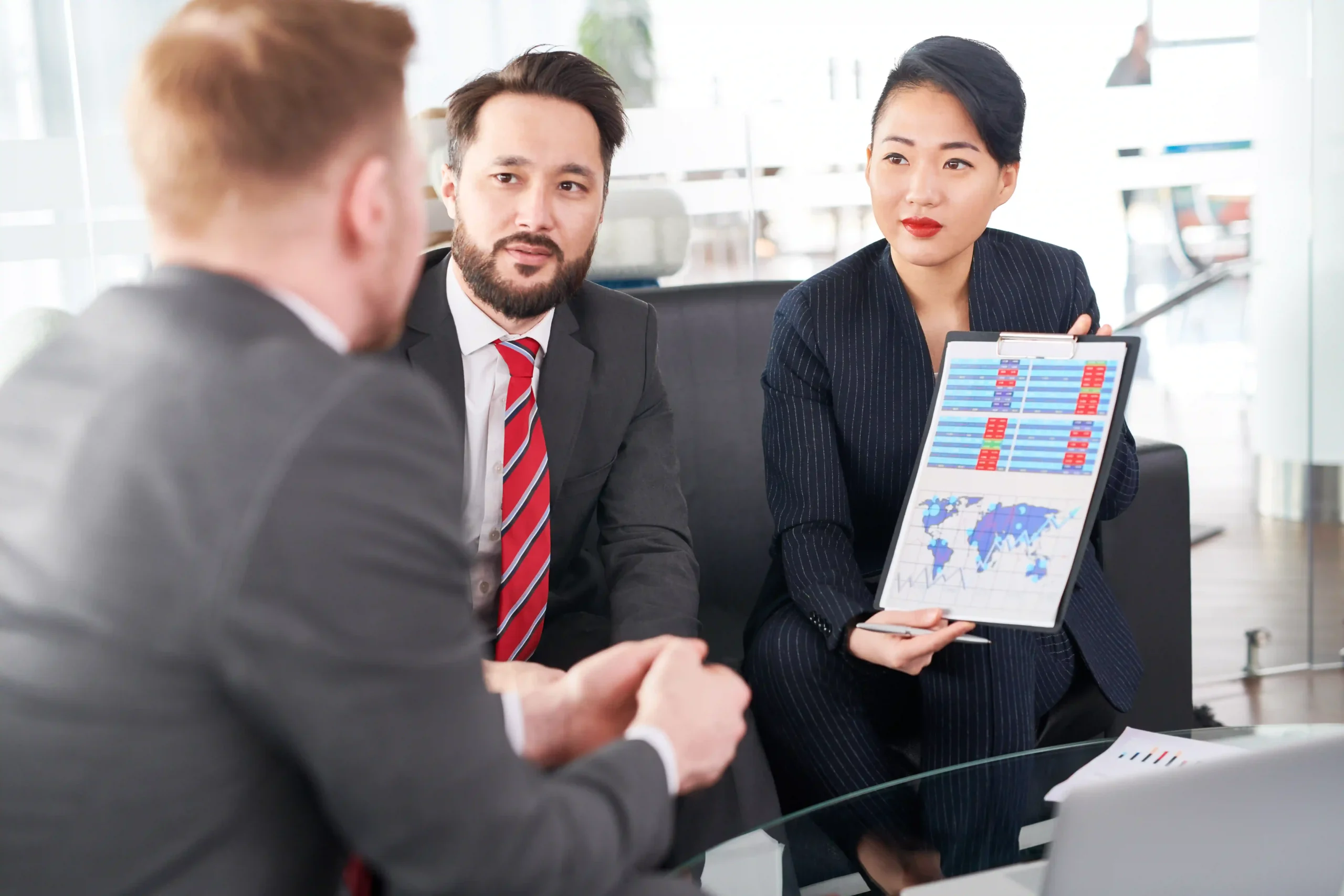 Business professionals reviewing trade data to align with FTZ compliance requirements 2025.