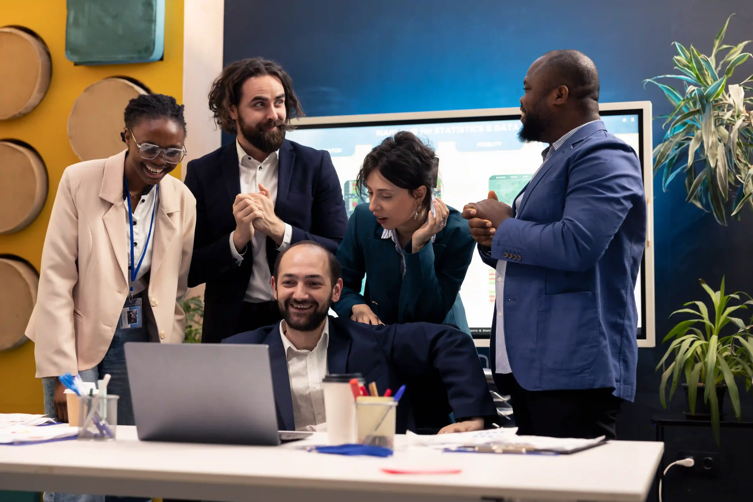 A logistics and finance team celebrating after a successful discussion on automation and AI at Logistics Innovation Day.