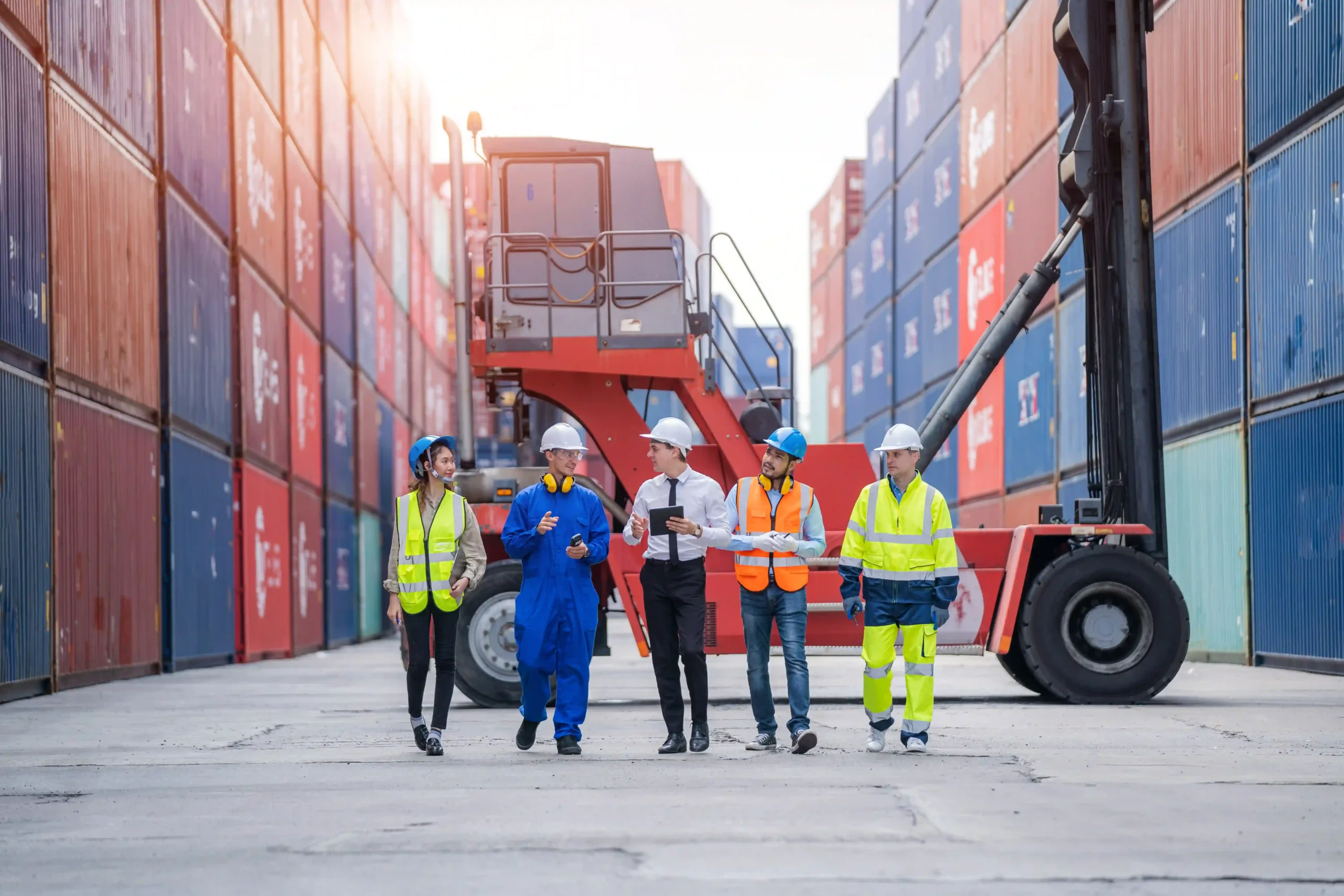A logistics team optimizing cargo container operations to improve supply chain cost optimization and reduce shipping expenses.