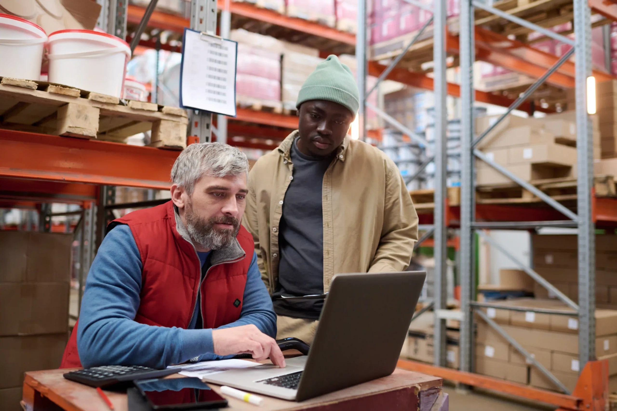 A supply chain manager using real-time tracking to optimize transportation routes and improve supply chain cost optimization.