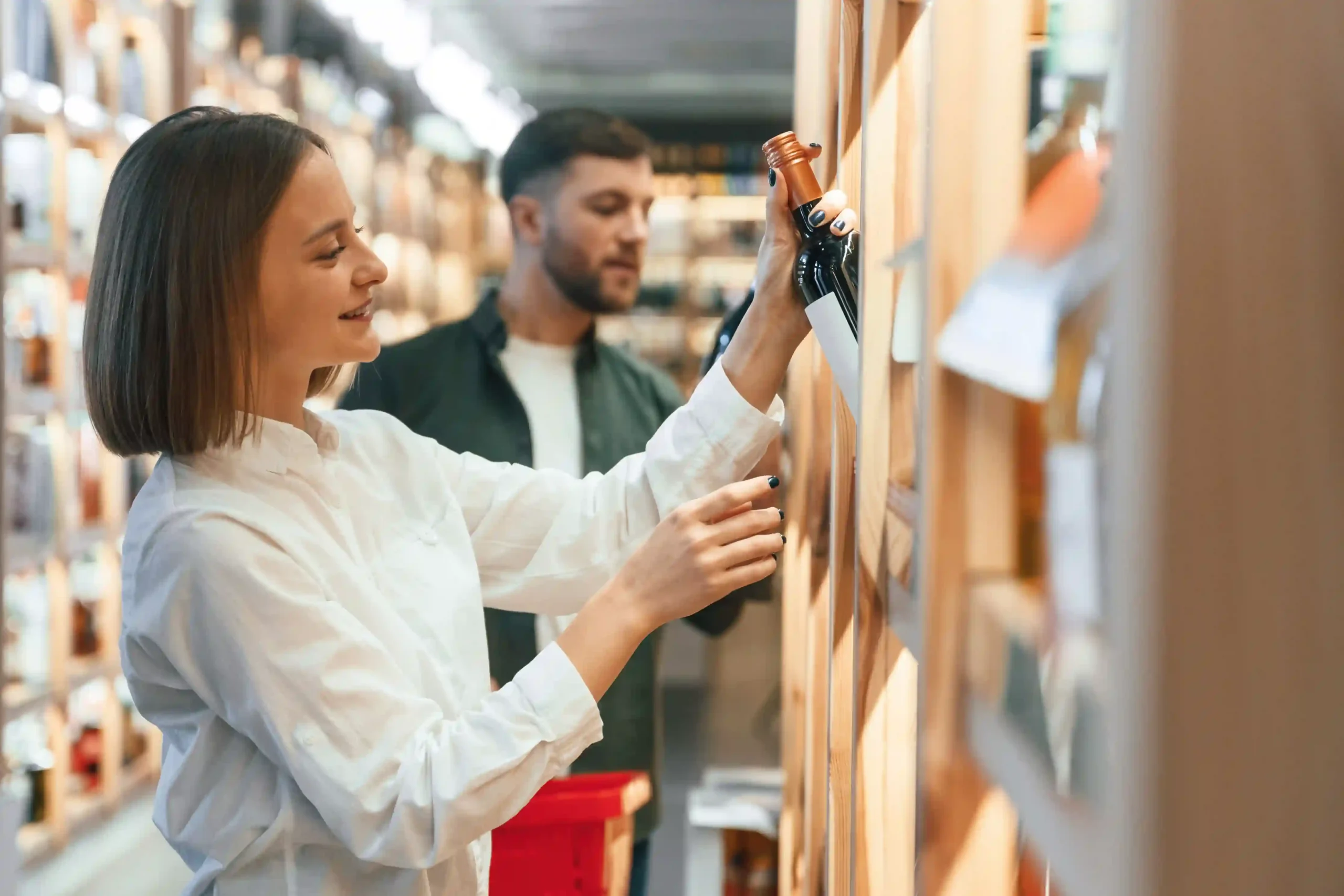 Inventory management explained in a retail setting as staff organizes shelf stock for customers
